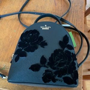 Mini Kate Spade black flower embossed backpack. Convertible